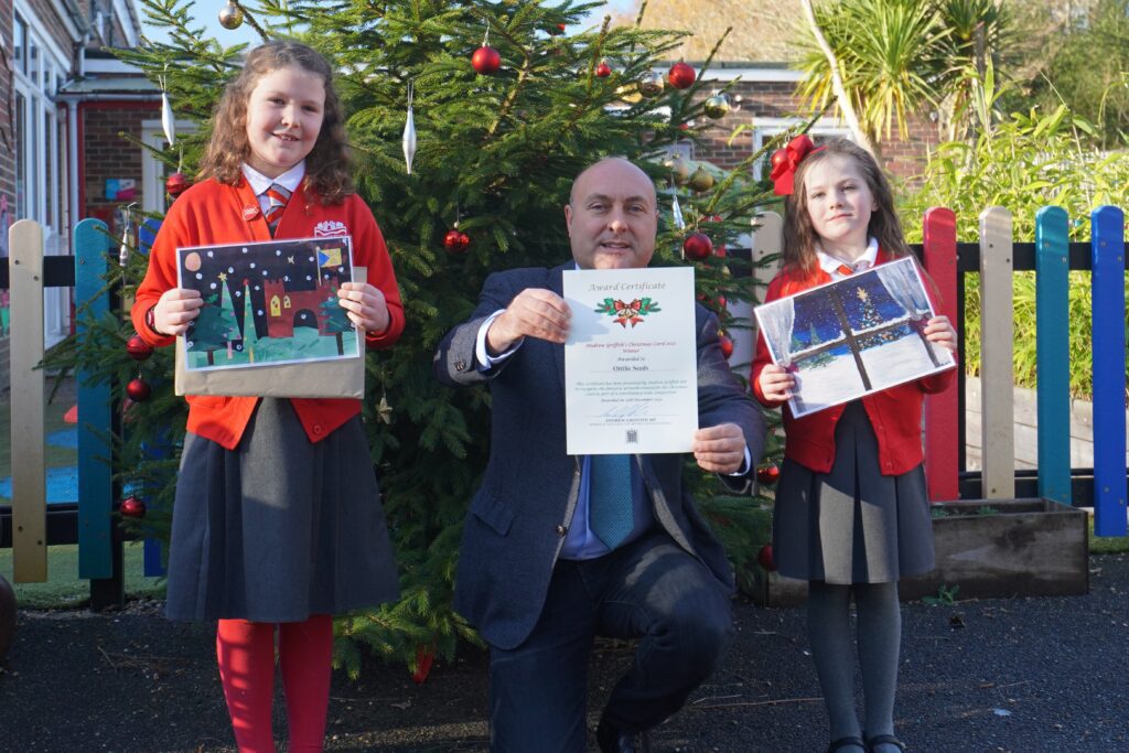 Ottilie and Poppy from Arundel Church of England Primary School win Andrew Griffith's Christmas card competition